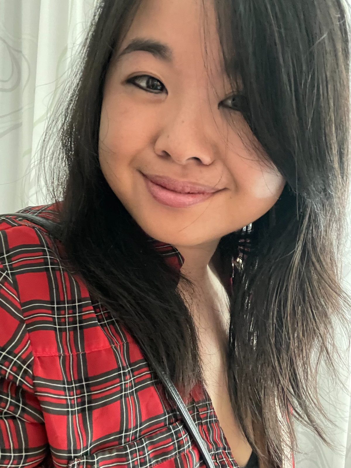 Erica C. Chen smiling warmly in a candid moment