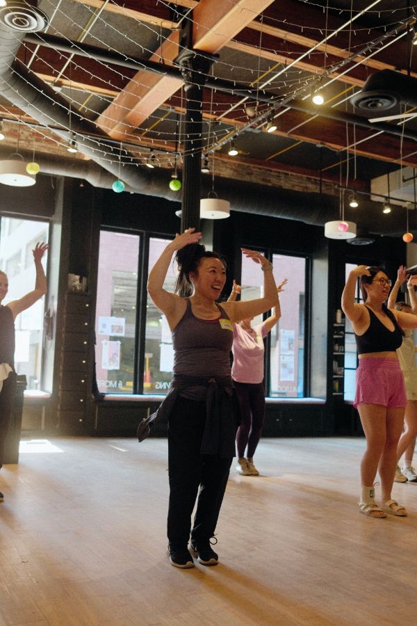 Arms in the air during a movement break