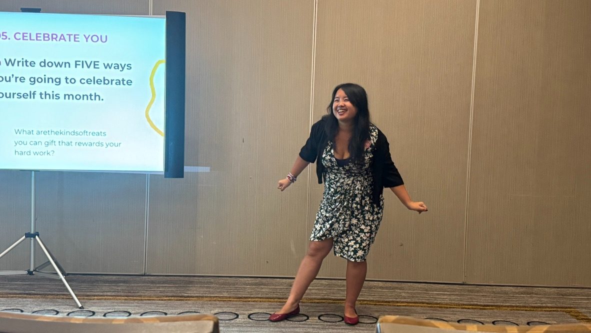Erica C. Chen laughing and gesturing during an interactive session